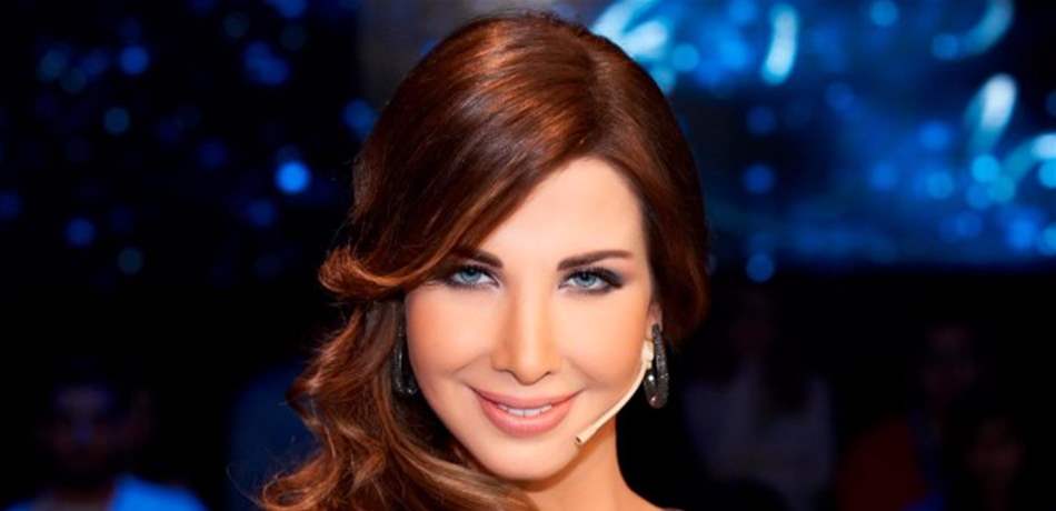 بالصورة.. شاهدوا نانسي عجرم بفستان الحمل لأول مرة