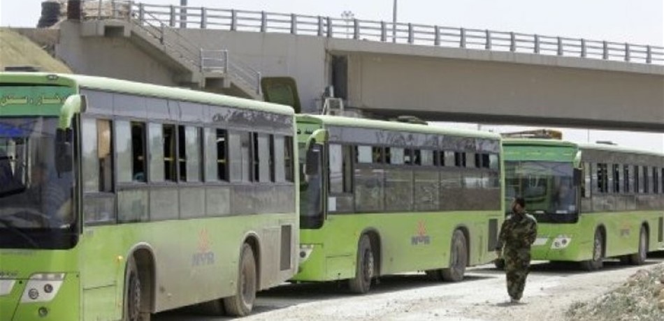 آلاف المقاتلين يغادرون عربين السورية إلى إدلب