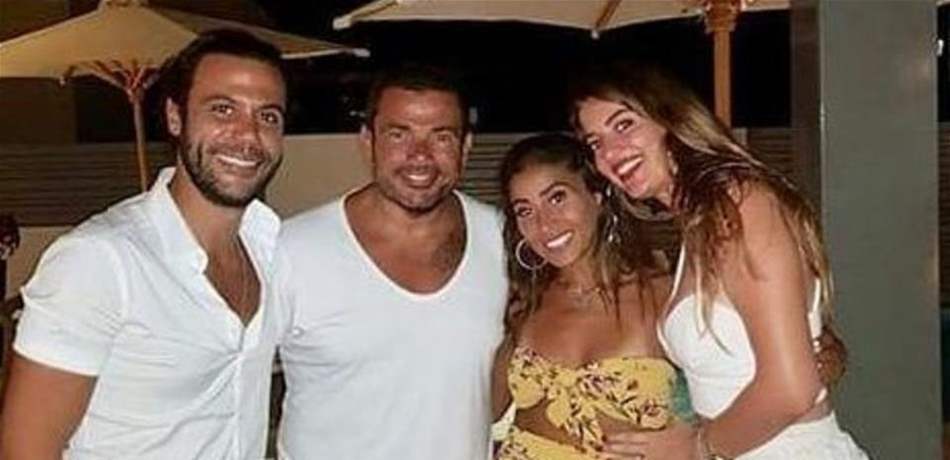 صورة لعمرو دياب ودينا الشربيني مع محمد إمام بشهر العسل